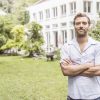 Portrait of mid adult man in front of house Portrait of mid adult man in front of house